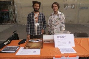 Jeremiah Moore and Jordan Sawyer checking out sound players at ISEA 2012, in downtown Albuquerque